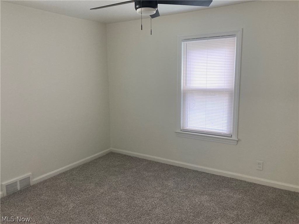 1407 Lander Road Cleveland, OH 44124 - Photo 25 of 33 Carpeted spare room featuring ceiling fan