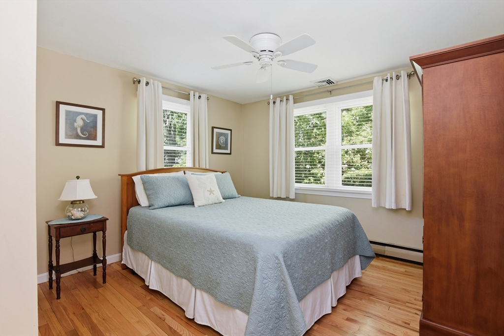 8 Emerald Way Sandwich, MA 02644 - Photo 21 of 36 a bedroom with a large bed and a window