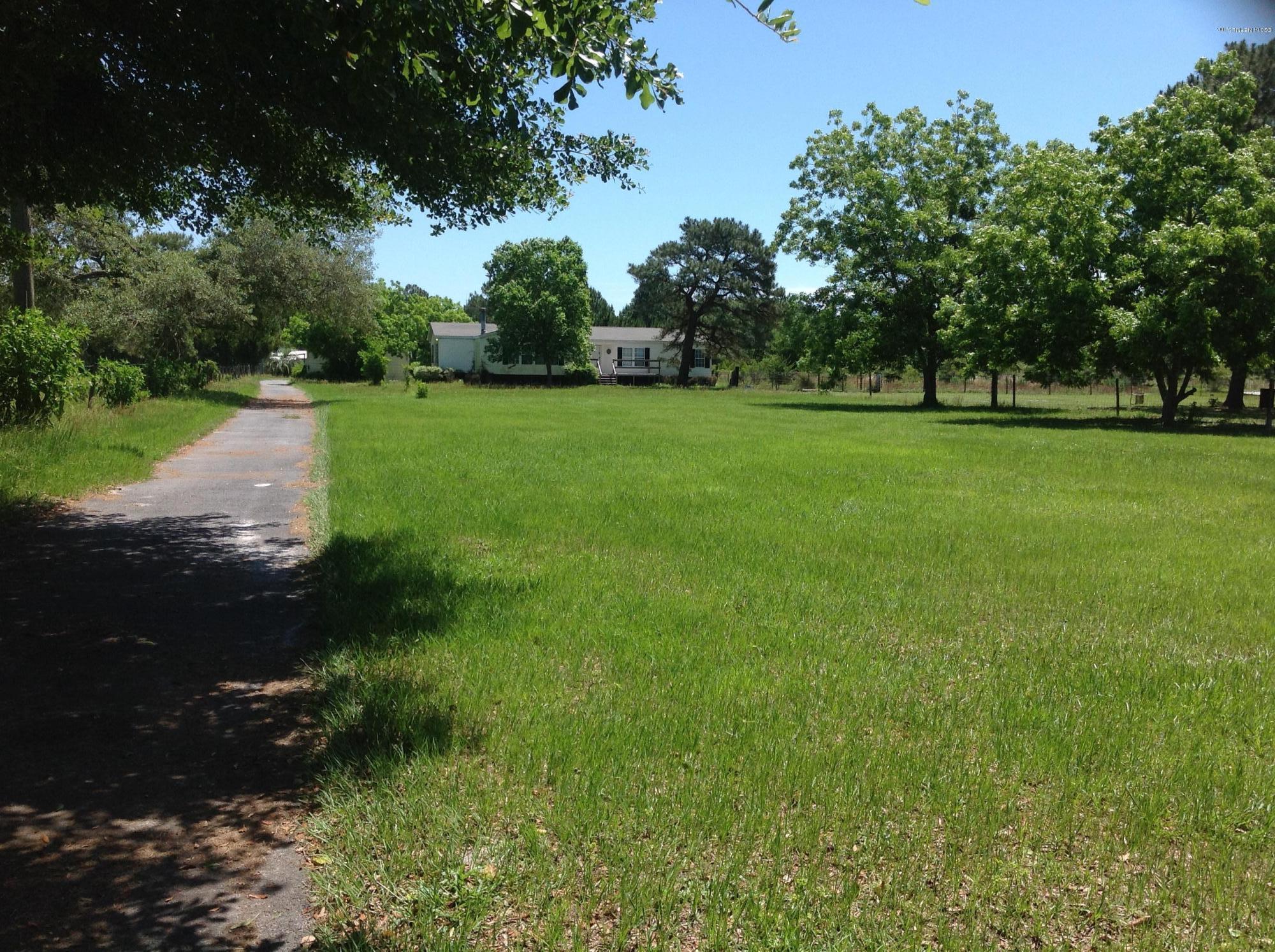 15741 Shark Road West Jacksonville, FL 32226 - Photo 5 of 23 Drive way from Gate