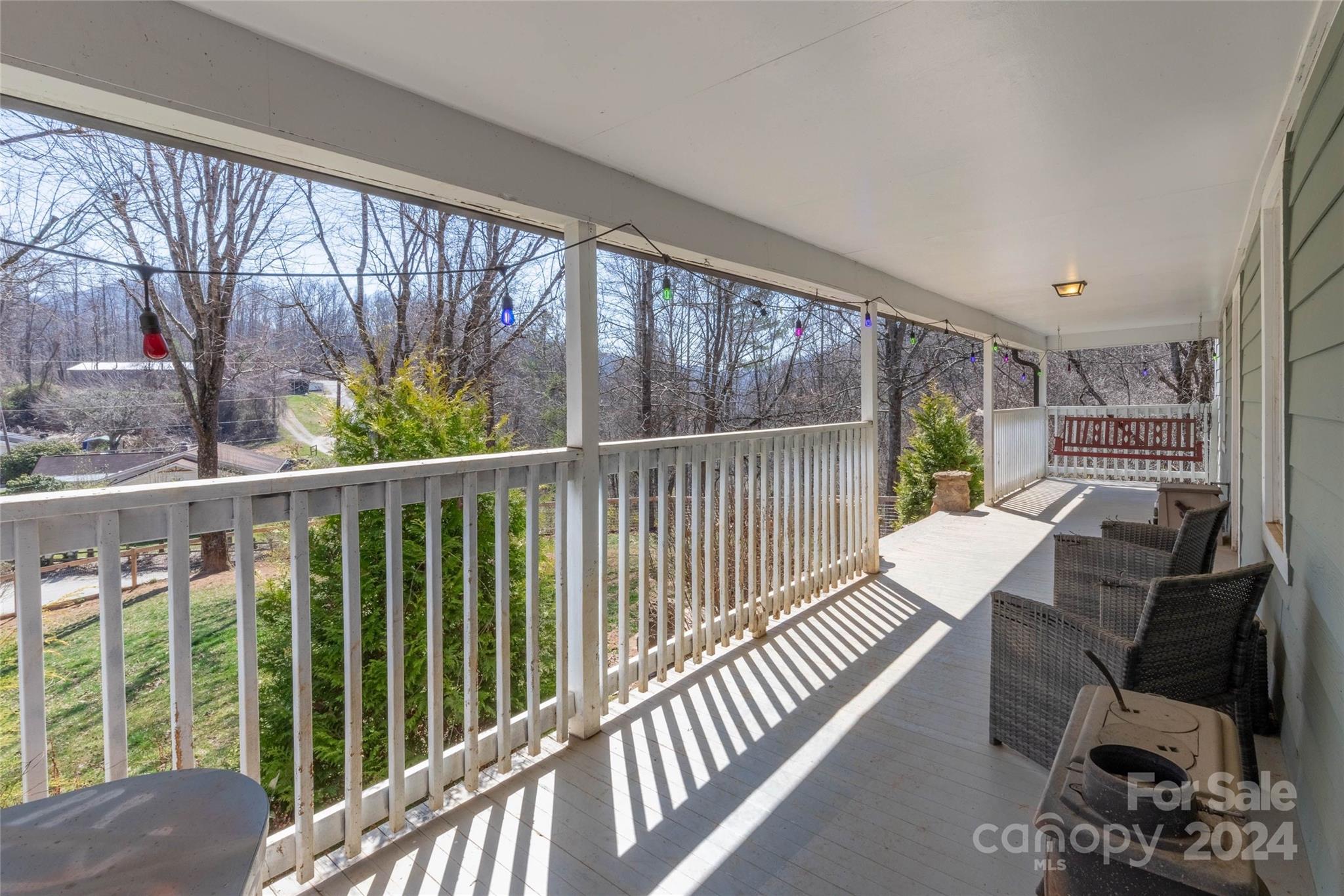 240 Henry Road Sylva, NC 28779 - Photo 9 of 41 a view of a balcony with chair and wooden floor
