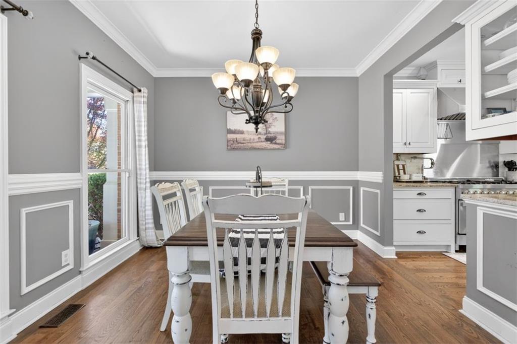 2700 Bay Ridge Drive Loganville, GA 30052 - Photo 11 of 62 a view of a dining room with furniture and wooden floor