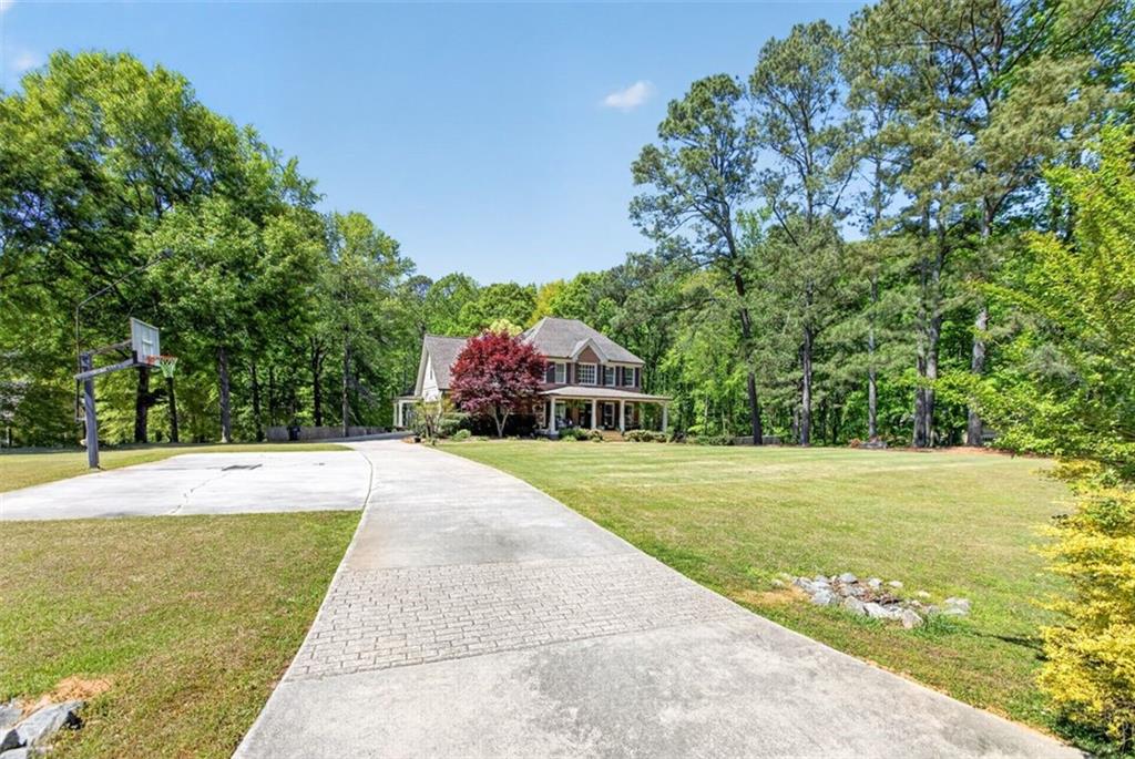 2700 Bay Ridge Drive Loganville, GA 30052 - Photo 2 of 62 a view of a swimming pool with a yard