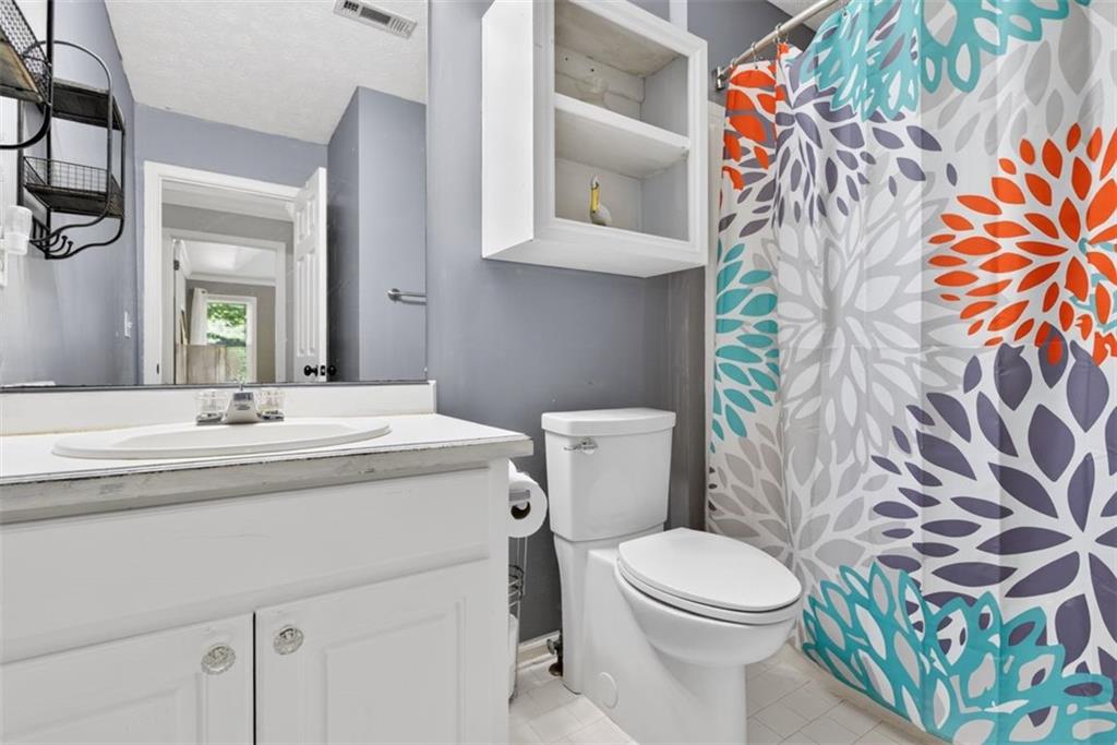 2700 Bay Ridge Drive Loganville, GA 30052 - Photo 40 of 62 a bathroom with a sink and a toilet