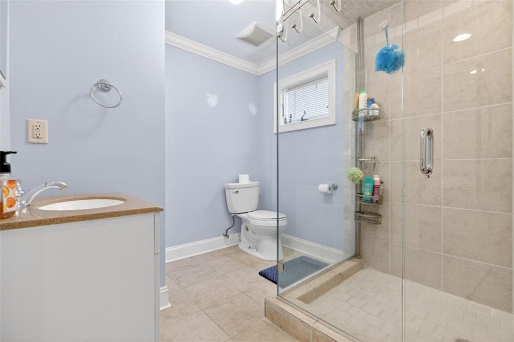 2700 Bay Ridge Drive Loganville, GA 30052 - Photo 55 of 62 a bathroom with a sink a toilet and shower