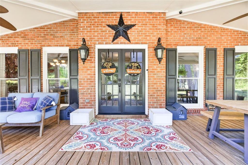 2700 Bay Ridge Drive Loganville, GA 30052 - Photo 7 of 62 a outdoor living space with furniture and a rug