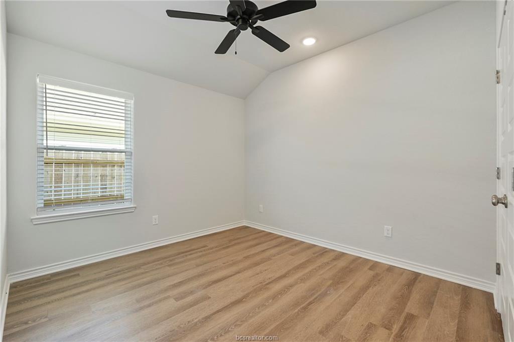 3124 Tarleton Court Bryan, TX 77808 - Photo 18 of 22 a view of a room with wooden floor and windows