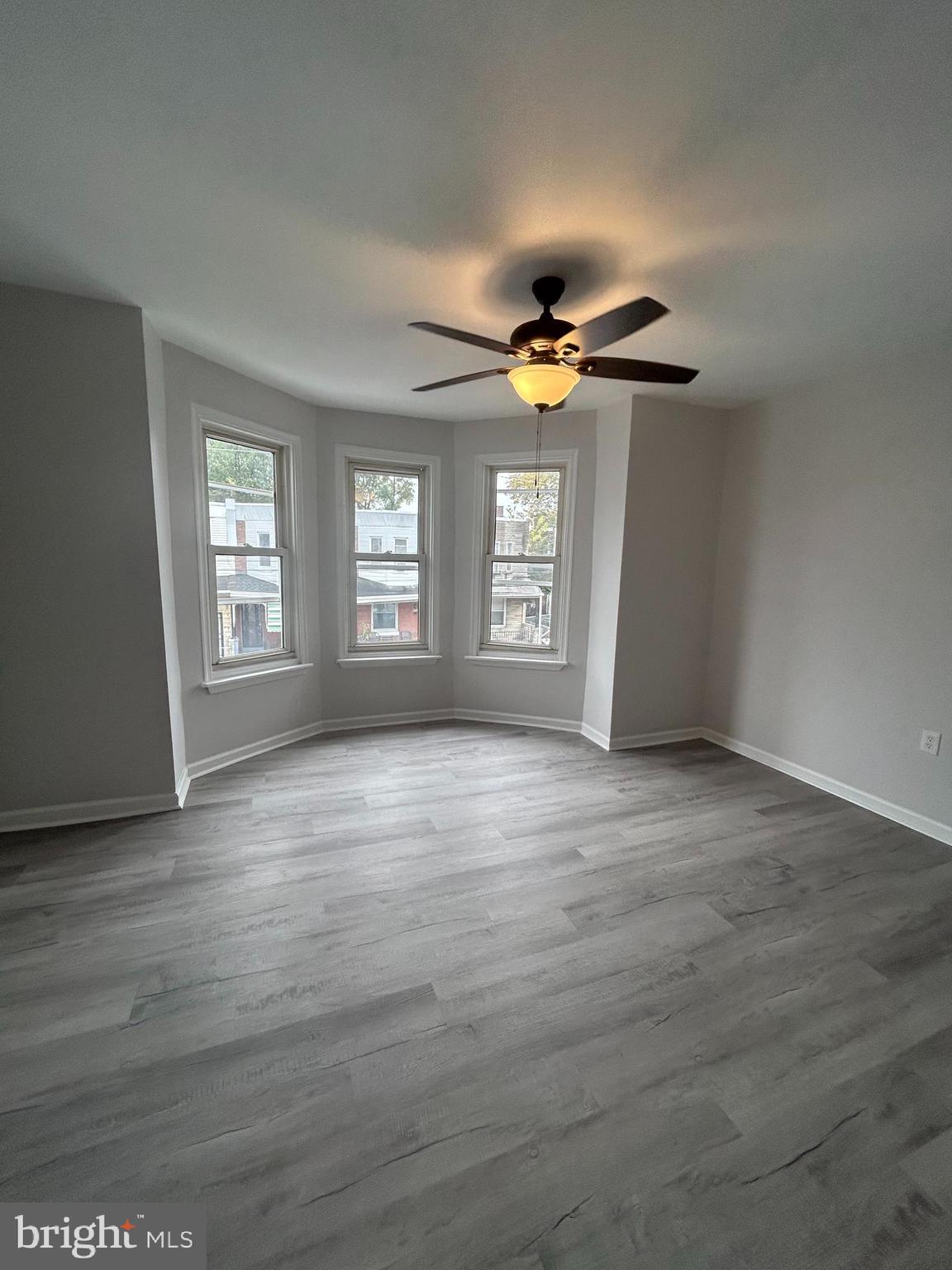5519 Race Street Philadelphia, PA 19139 - Photo 12 of 25 an empty room with wooden floor and windows