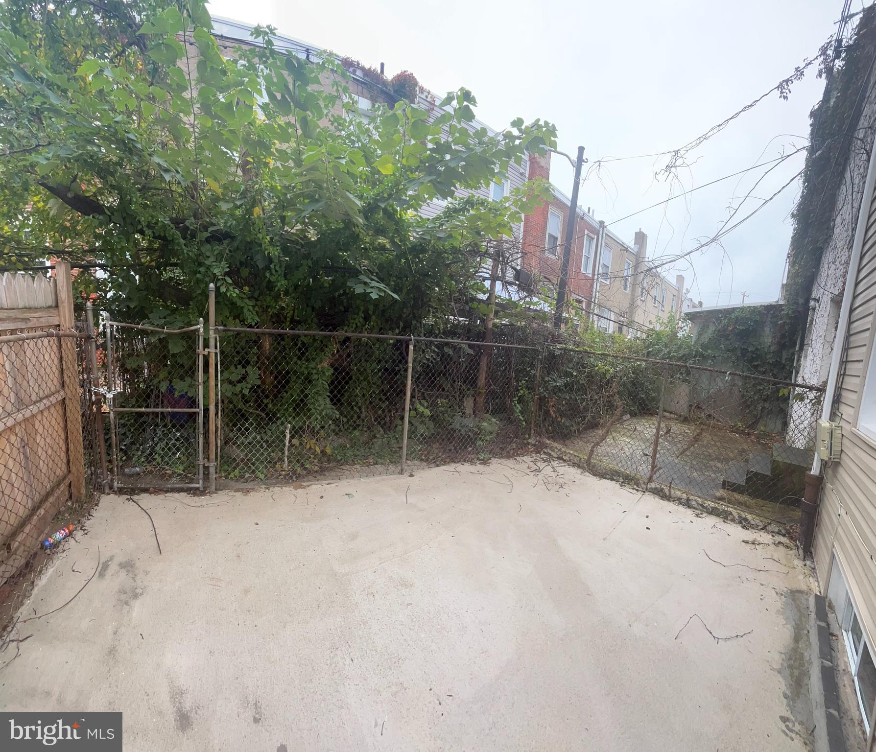 5519 Race Street Philadelphia, PA 19139 - Photo 18 of 25 a backyard of a house with lots of green space