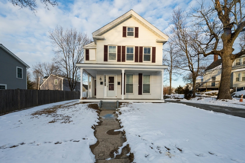 front view of a house with a yard