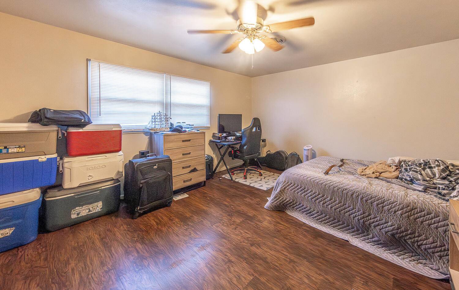 2408 33rd Street Lubbock, TX 79411 - Photo 11 of 31 a bedroom with furniture and a large window