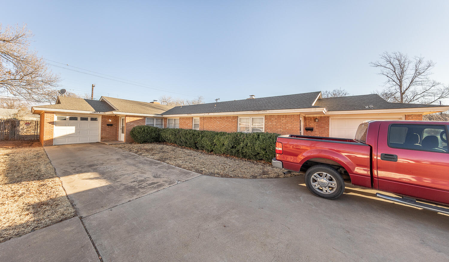 2408 33rd Street Lubbock, TX 79411 - Photo 16 of 31 a view of a car in front of a building
