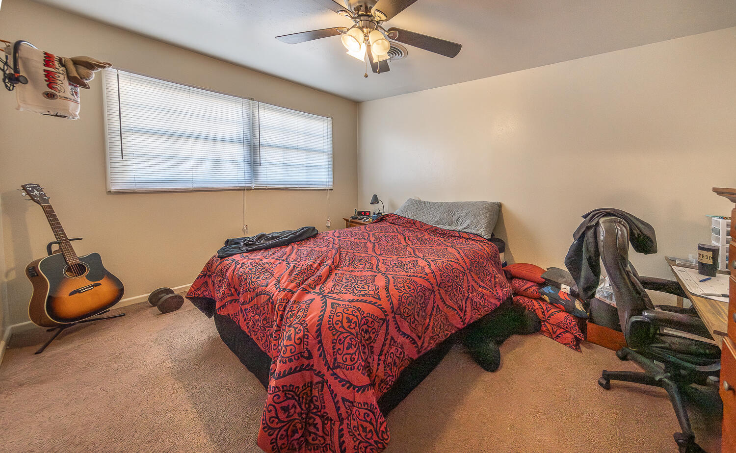 2408 33rd Street Lubbock, TX 79411 - Photo 19 of 31 a bedroom with bed and window