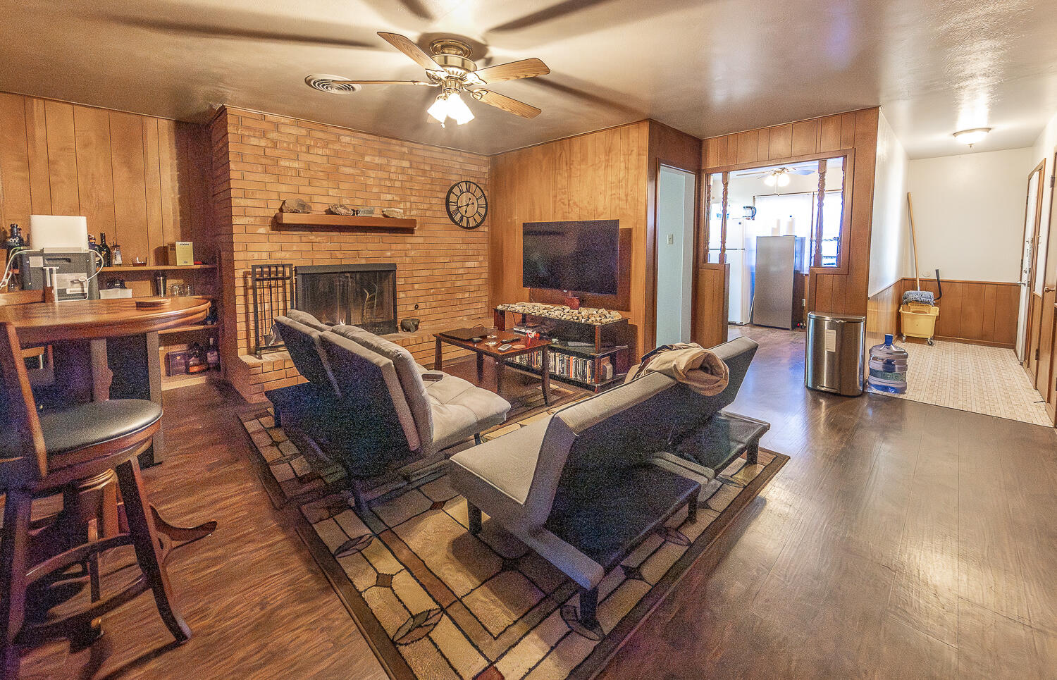 2408 33rd Street Lubbock, TX 79411 - Photo 2 of 31 a living room with furniture fireplace and a flat screen tv