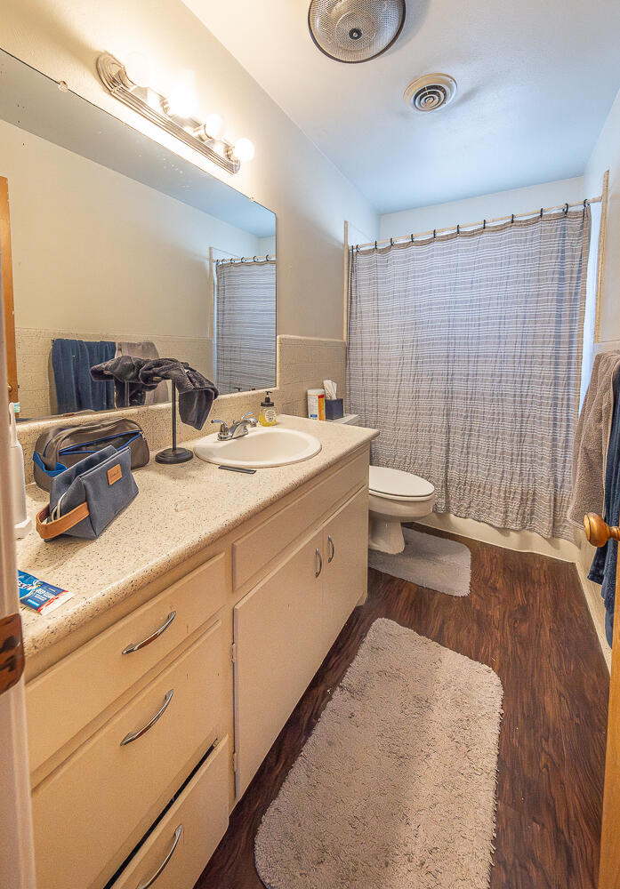 2408 33rd Street Lubbock, TX 79411 - Photo 21 of 31 a spacious bathroom with double vanity sink a mirror and a shower