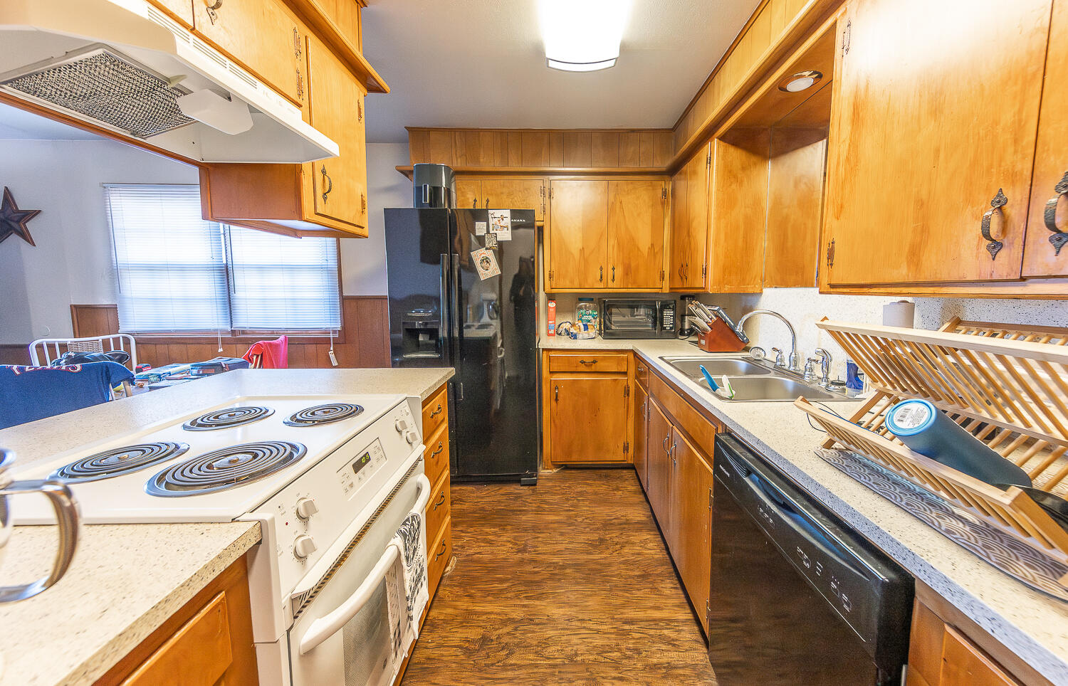 2408 33rd Street Lubbock, TX 79411 - Photo 22 of 31 a kitchen with stainless steel appliances granite countertop a sink stove and refrigerator