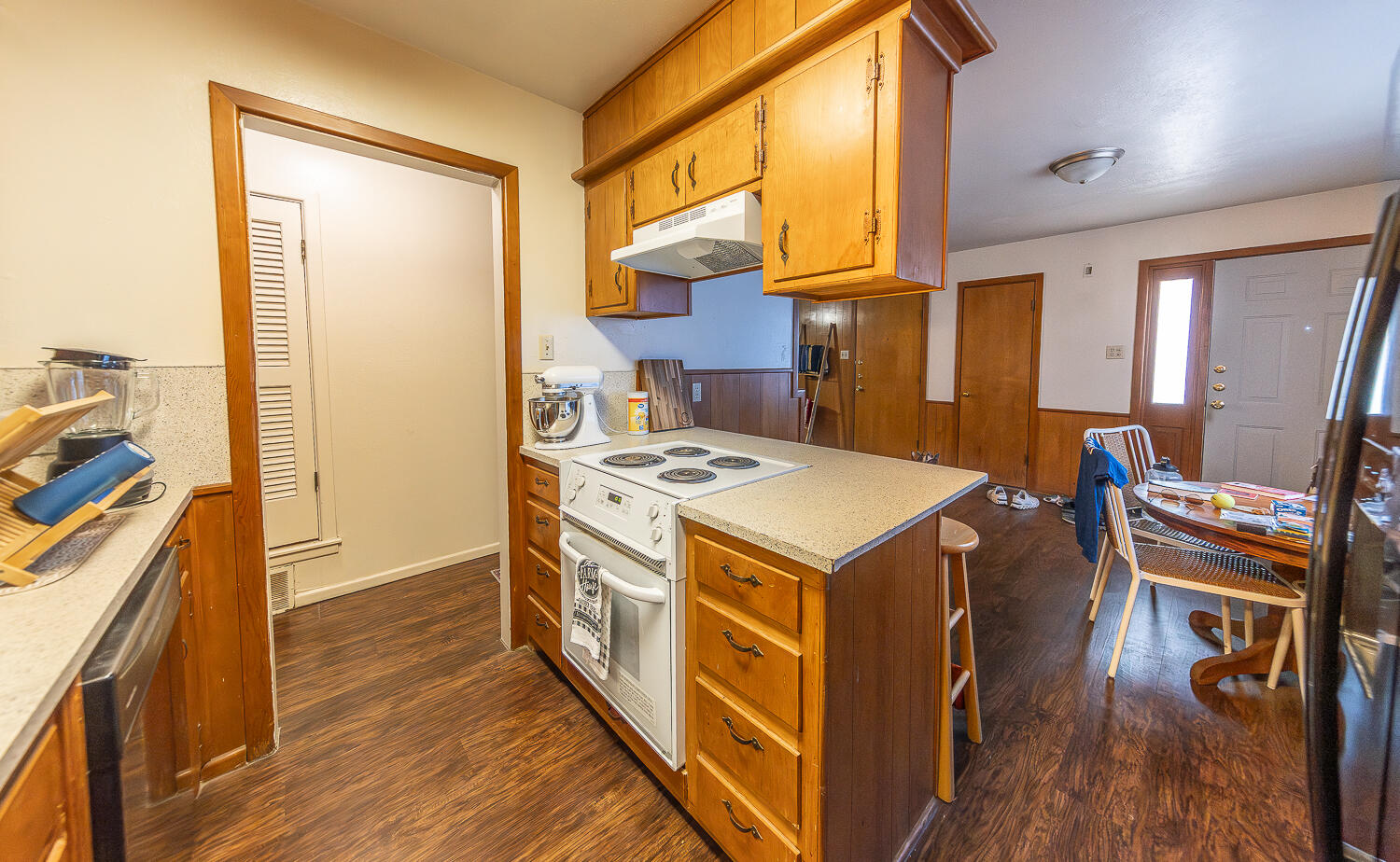 2408 33rd Street Lubbock, TX 79411 - Photo 24 of 31 a kitchen that has a stove and a wooden floor