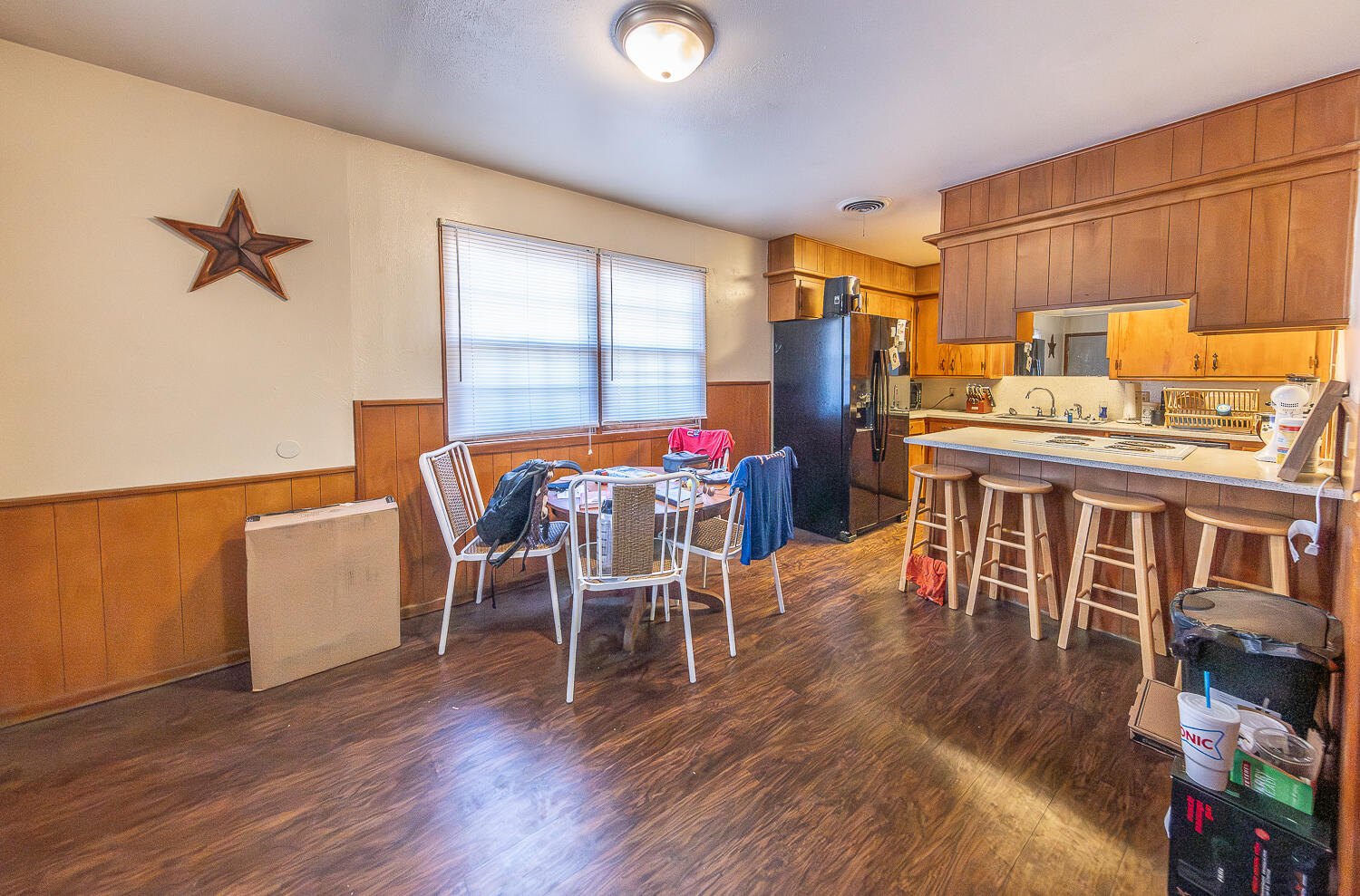 2408 33rd Street Lubbock, TX 79411 - Photo 26 of 31 a dining room with furniture and wooden floor