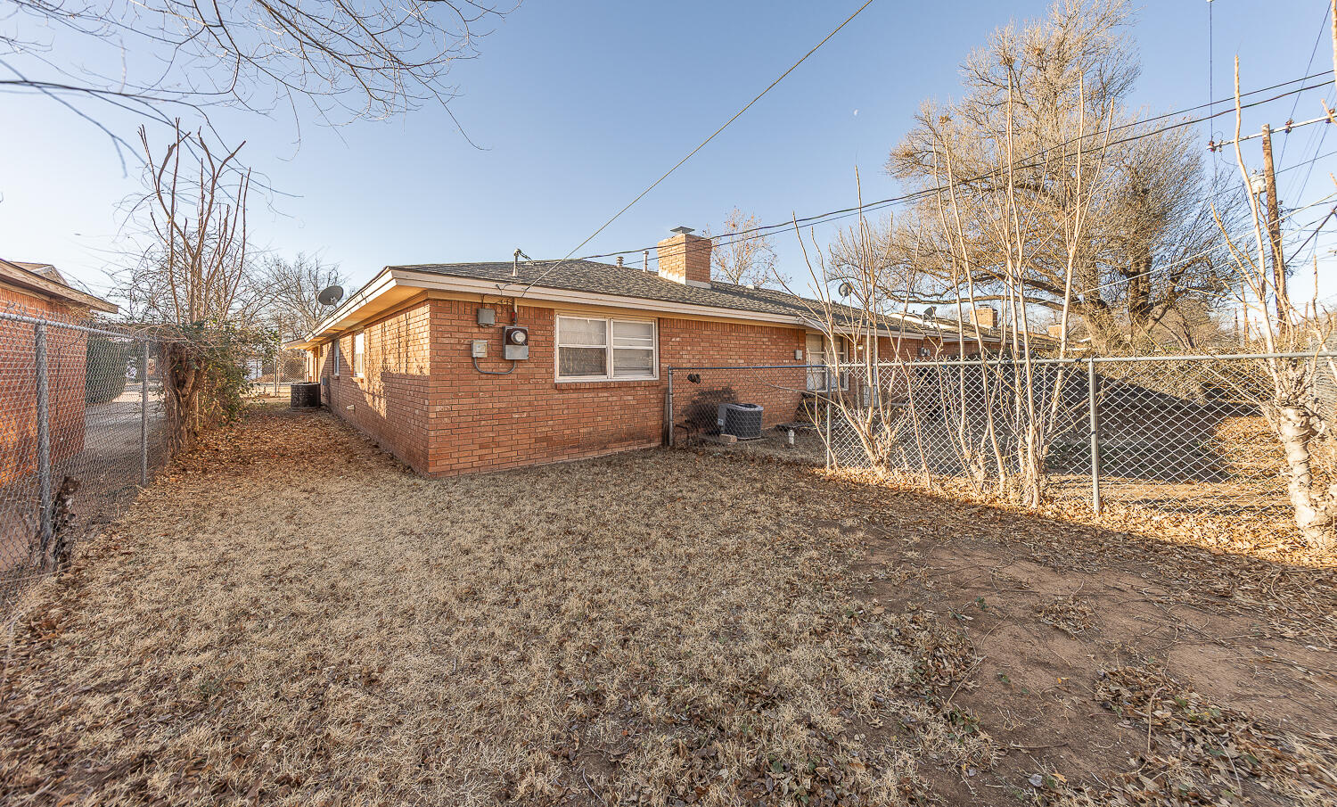 2408 33rd Street Lubbock, TX 79411 - Photo 30 of 31 a view of a house with a backyard