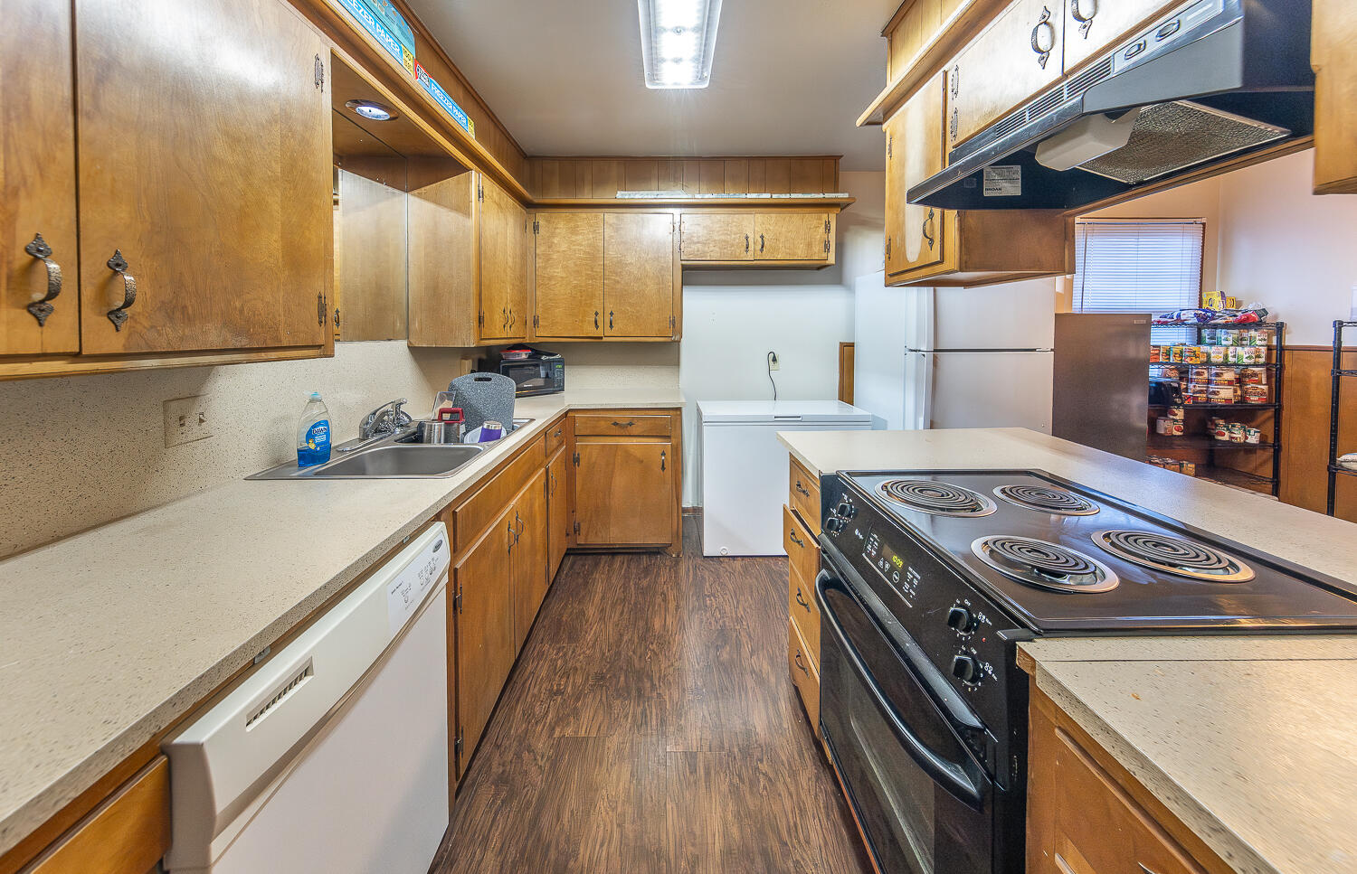 2408 33rd Street Lubbock, TX 79411 - Photo 3 of 31 a kitchen with stainless steel appliances granite countertop a stove and a sink
