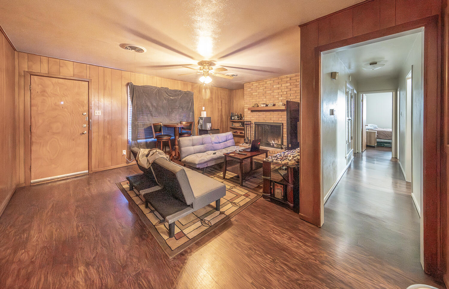 2408 33rd Street Lubbock, TX 79411 - Photo 4 of 31 a living room with furniture and a wooden floor
