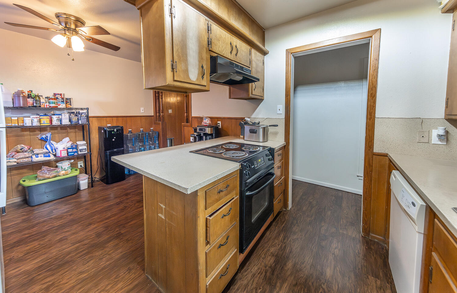 2408 33rd Street Lubbock, TX 79411 - Photo 5 of 31 a kitchen with stainless steel appliances granite countertop a stove and a refrigerator
