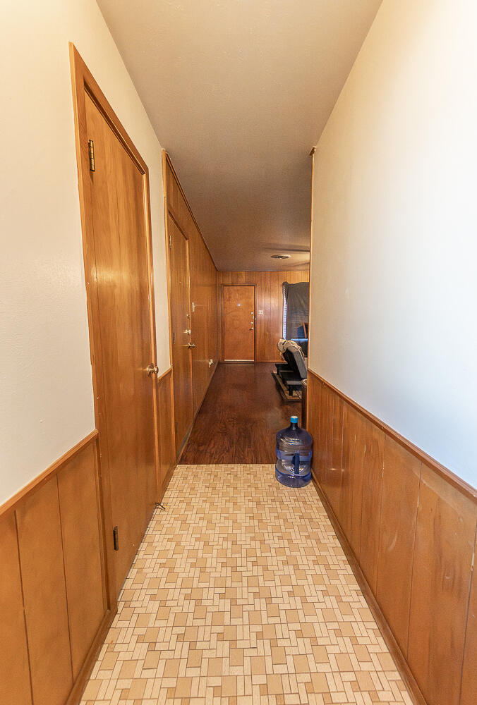 2408 33rd Street Lubbock, TX 79411 - Photo 8 of 31 a hallway view with large mirror