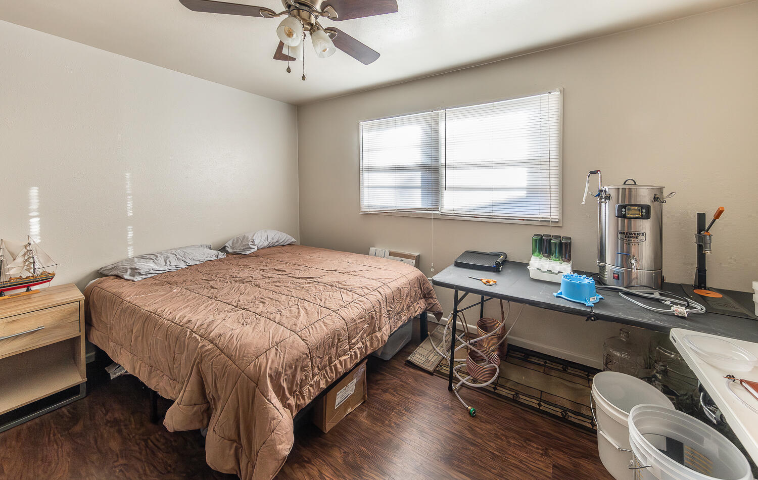 2408 33rd Street Lubbock, TX 79411 - Photo 10 of 31 a bedroom with a bed and a desk