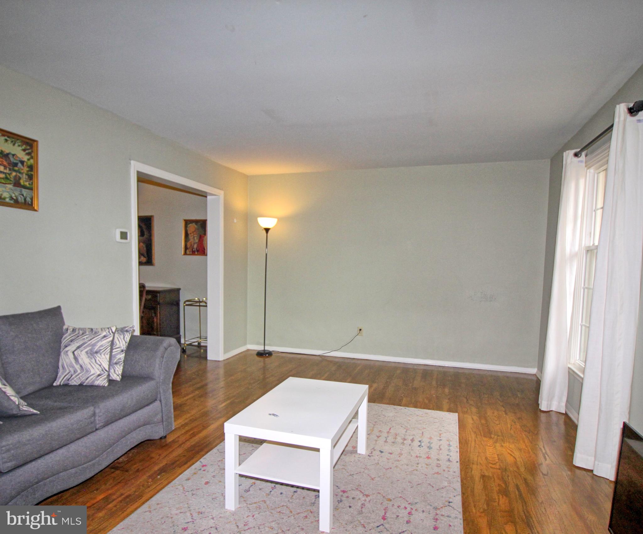 5108 New Kent Road Wilmington, DE 19808 - Photo 11 of 26 a living room with furniture and a fireplace