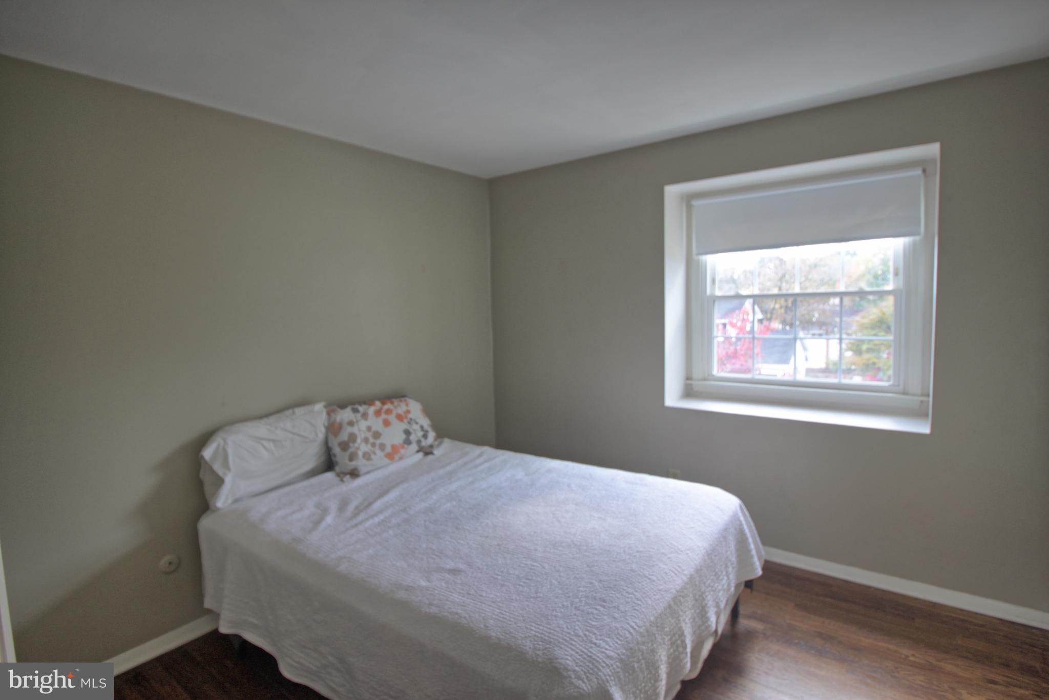 5108 New Kent Road Wilmington, DE 19808 - Photo 17 of 26 a bedroom with a bed and a window
