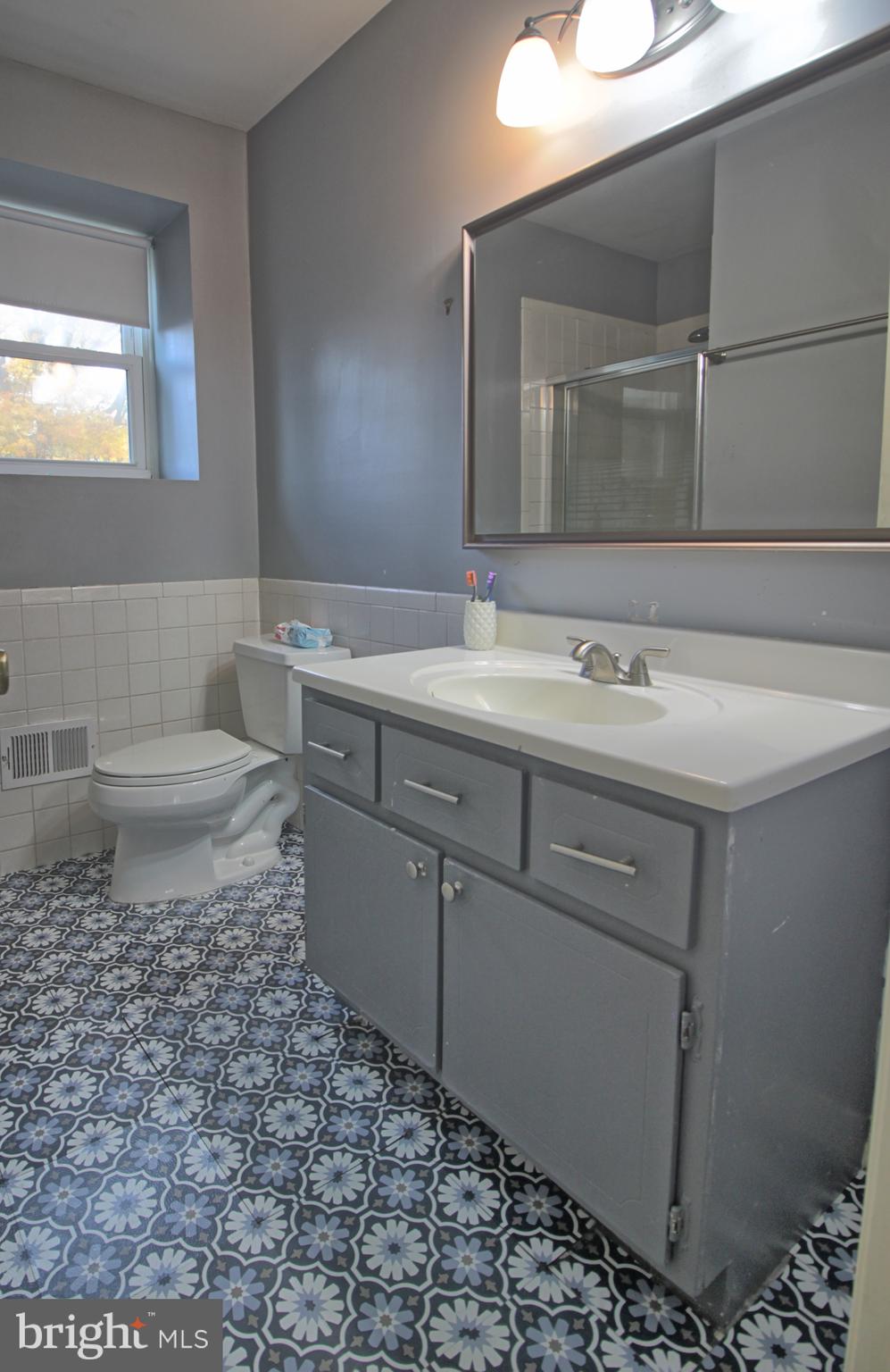 5108 New Kent Road Wilmington, DE 19808 - Photo 23 of 26 a bathroom with a sink toilet and mirror