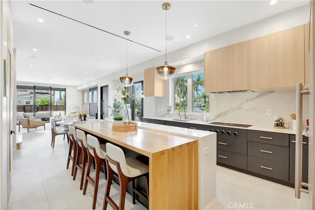 a living room with furniture a rug and a flat screen tv