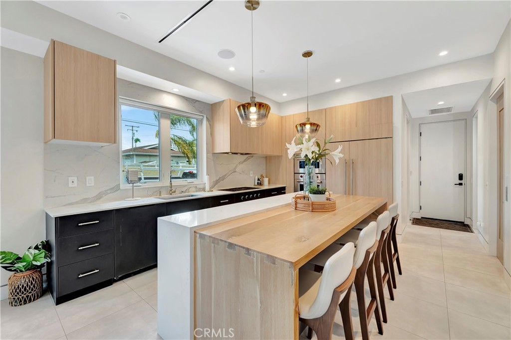620 Huntington Street Huntington Beach, CA 92648 - Photo 15 of 65 a kitchen with a table and chairs in it