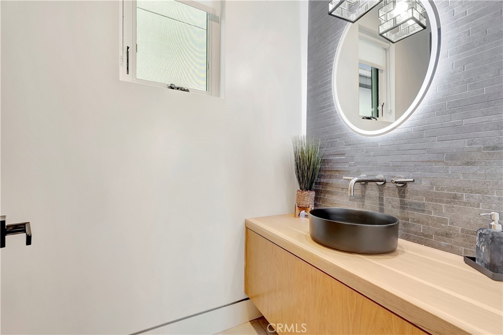 620 Huntington Street Huntington Beach, CA 92648 - Photo 20 of 65 a close view of sink and mirror