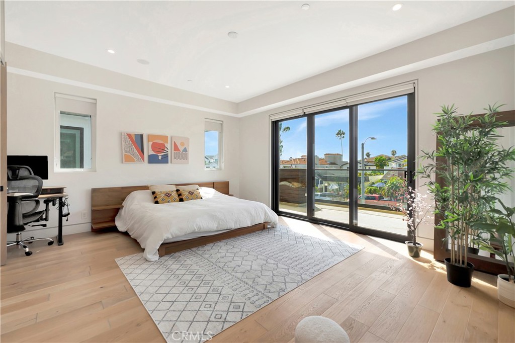 620 Huntington Street Huntington Beach, CA 92648 - Photo 27 of 65 a bedroom with a large bed and a large window