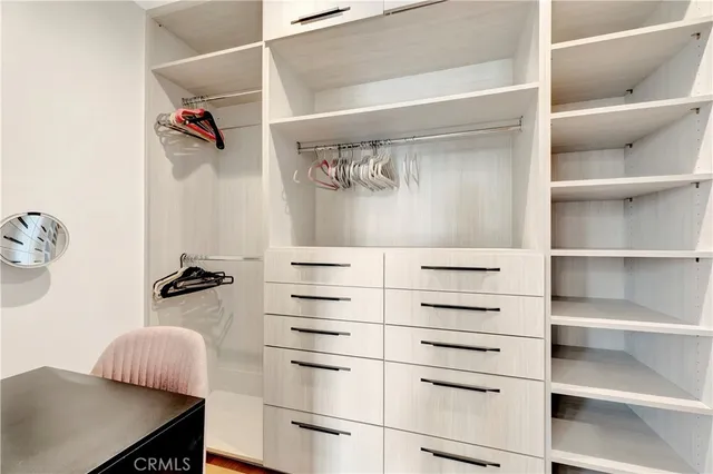 a balcony with chairs and a table