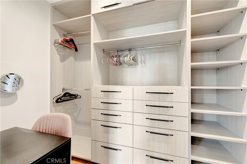 620 Huntington Street Huntington Beach, CA 92648 - Photo 30 of 65 a view of walk in closet with clothes and shoes