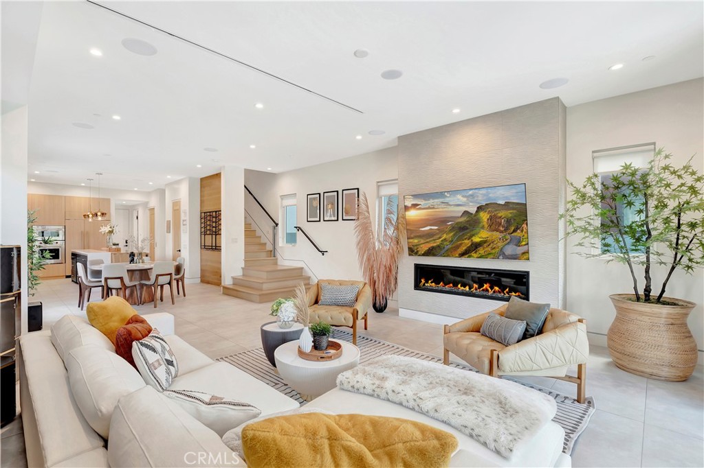 620 Huntington Street Huntington Beach, CA 92648 - Photo 3 of 65 a living room with furniture a rug and a flat screen tv