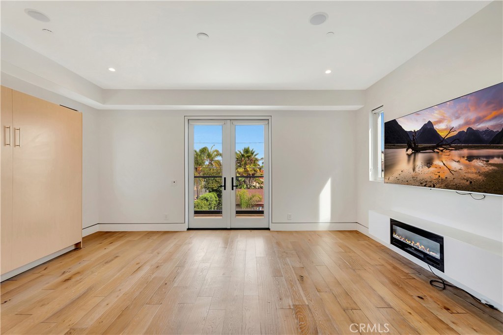 620 Huntington Street Huntington Beach, CA 92648 - Photo 42 of 65 a view of an empty room with wooden floor and a window
