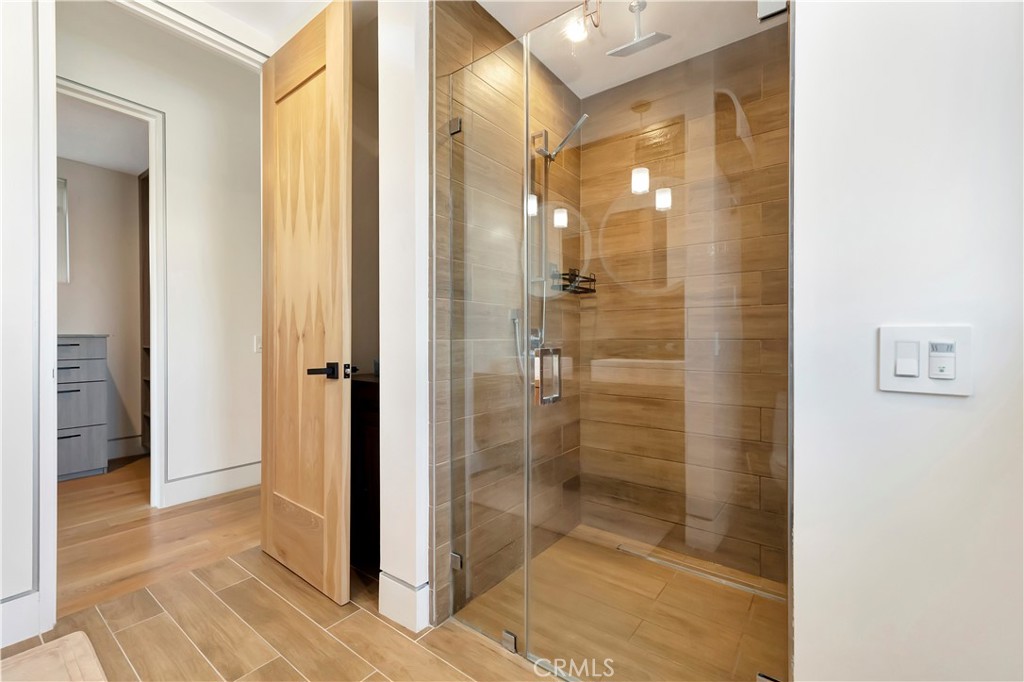 620 Huntington Street Huntington Beach, CA 92648 - Photo 46 of 65 a bathroom with a glass shower door