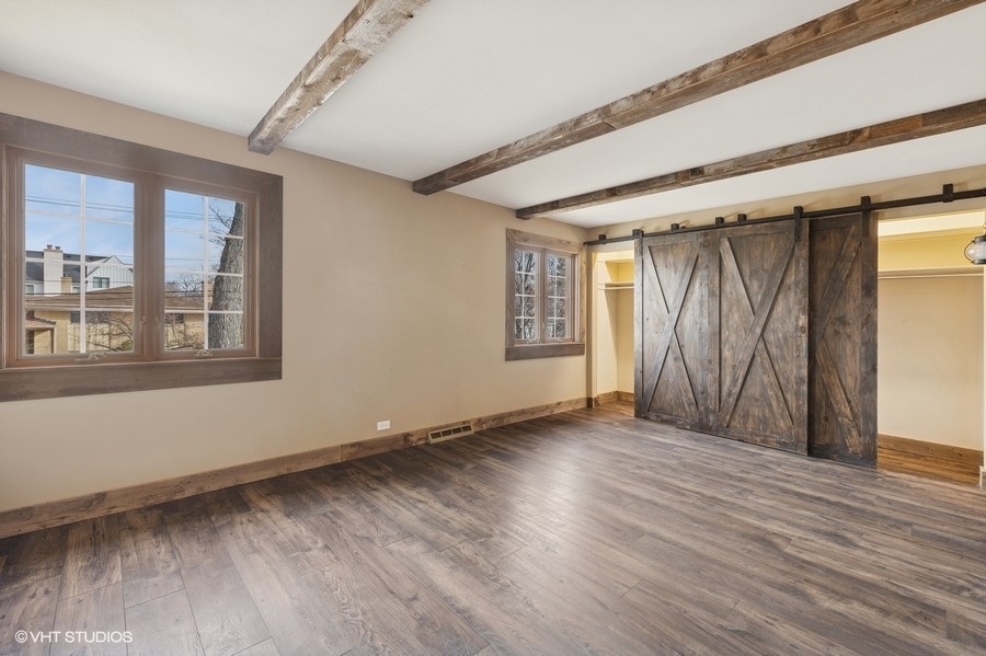 314 Fuller Road Hinsdale, IL 60521 - Photo 13 of 21 a view of a room with wooden floor and windows