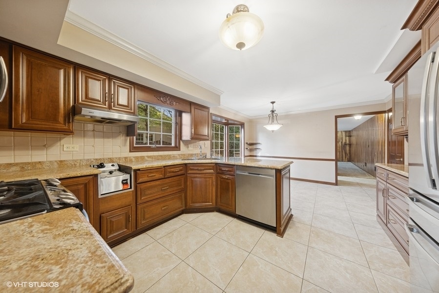 314 Fuller Road Hinsdale, IL 60521 - Photo 5 of 21 a kitchen with stainless steel appliances granite countertop a stove and a sink