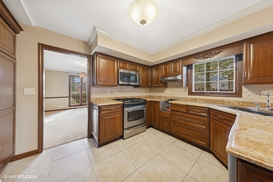314 Fuller Road Hinsdale, IL 60521 - Photo 6 of 21 a kitchen with stainless steel appliances granite countertop a stove and a sink