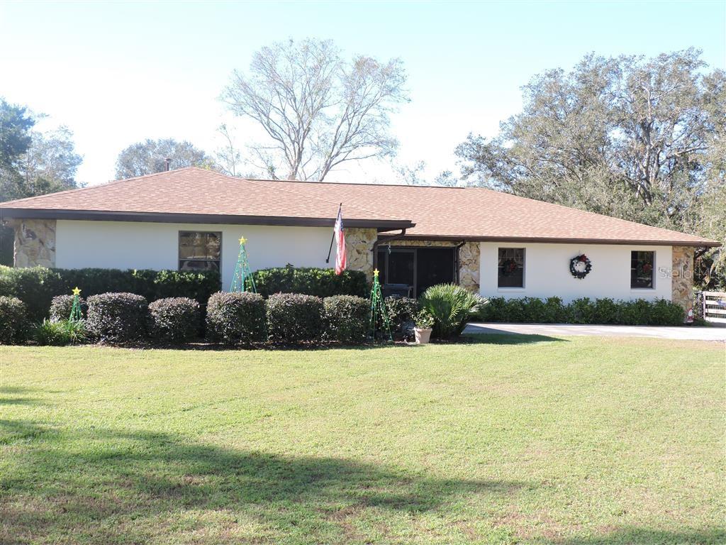 2153 Capps Road Lake Wales, FL 33898 - Photo 1 of 1 a view of house with swimming pool outdoor seating and yard