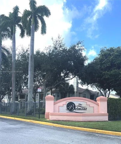 a front view of a house with swimming pool and a yard