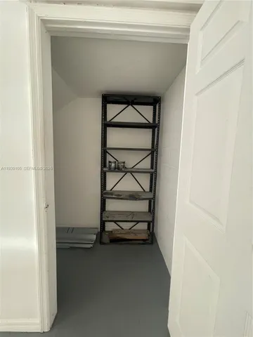 a city street lined with buildings and trees