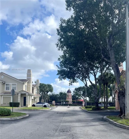 a view of a trees in front of a house
