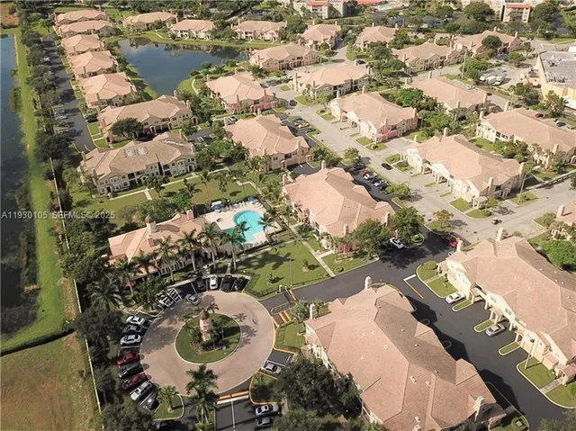 a view of a swimming pool with a yard