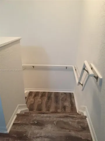 a utility room with cabinets washer and dryer