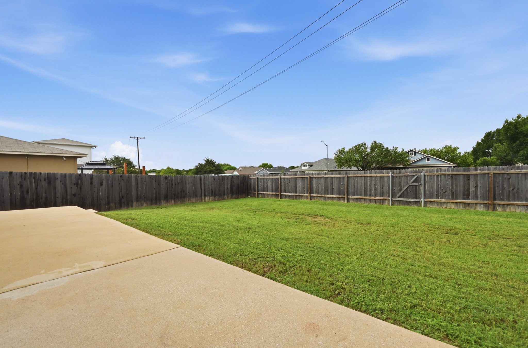 112 Mason Reed Cove Kyle, TX 78640 - Photo 22 of 26 a view of a backyard
