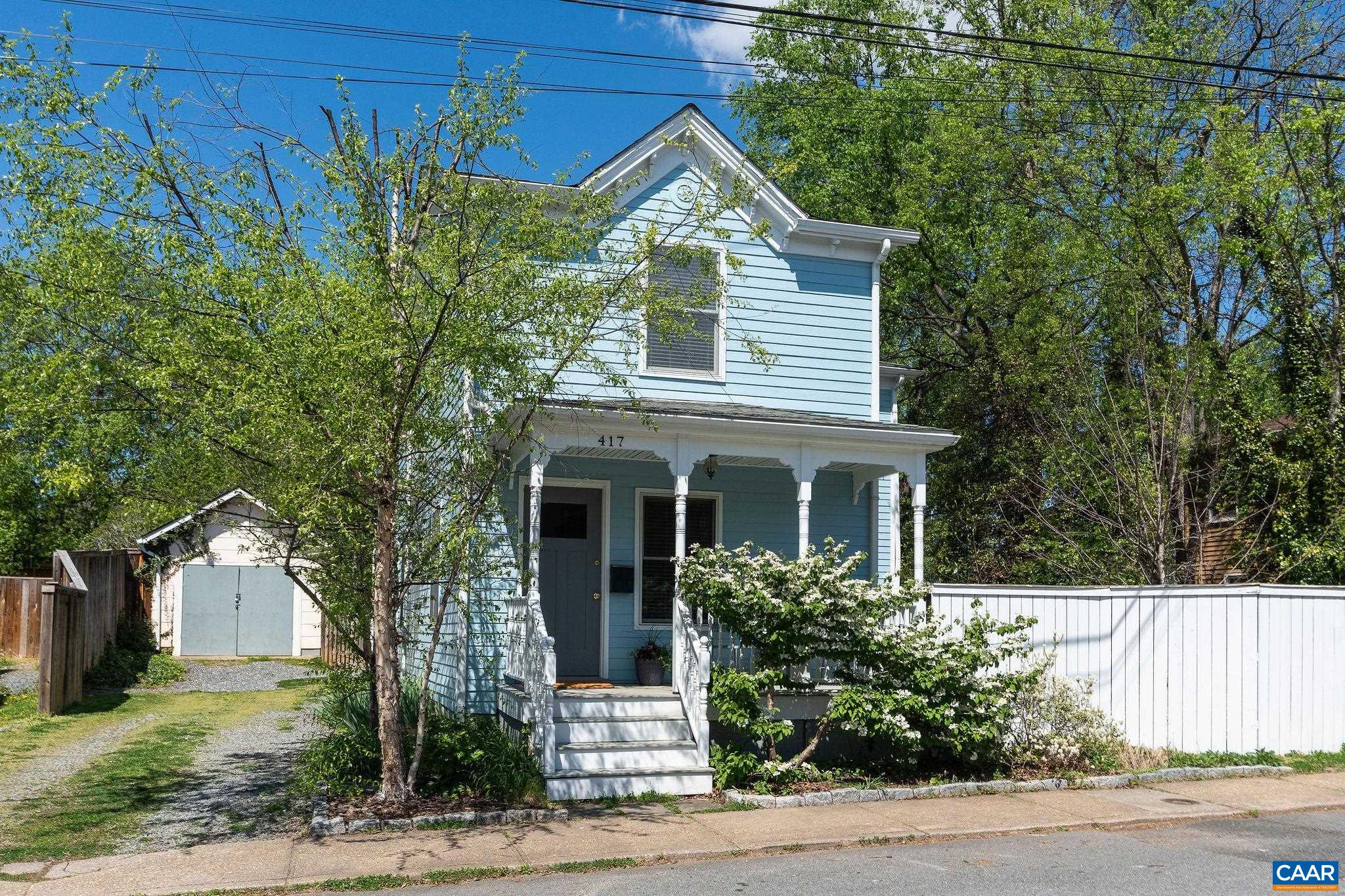 417 9th Street Northwest Charlottesville, VA 22903 - Photo 1 of 33 a front view of a house with a tree